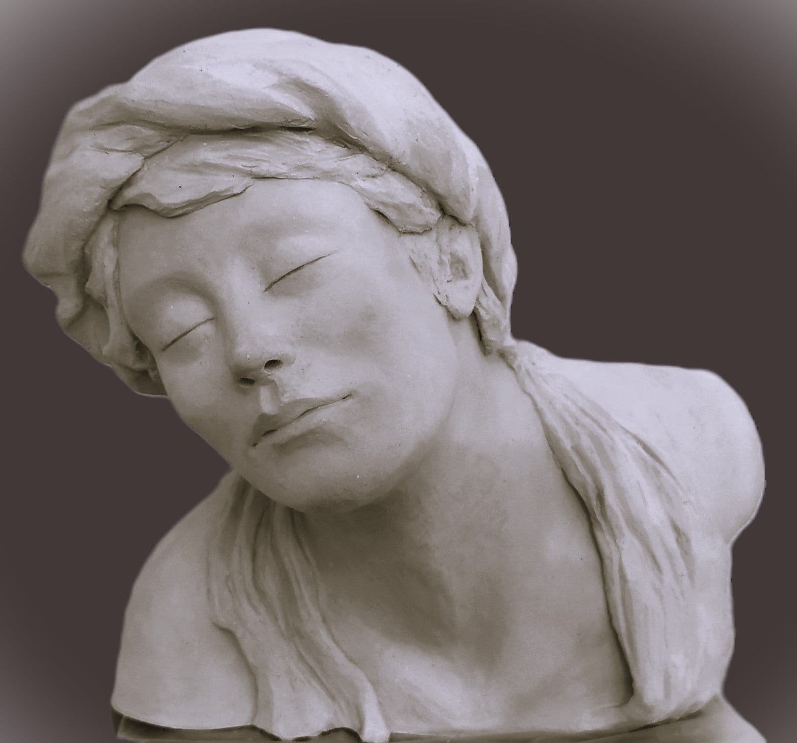 a close up of a silver object on a black background .